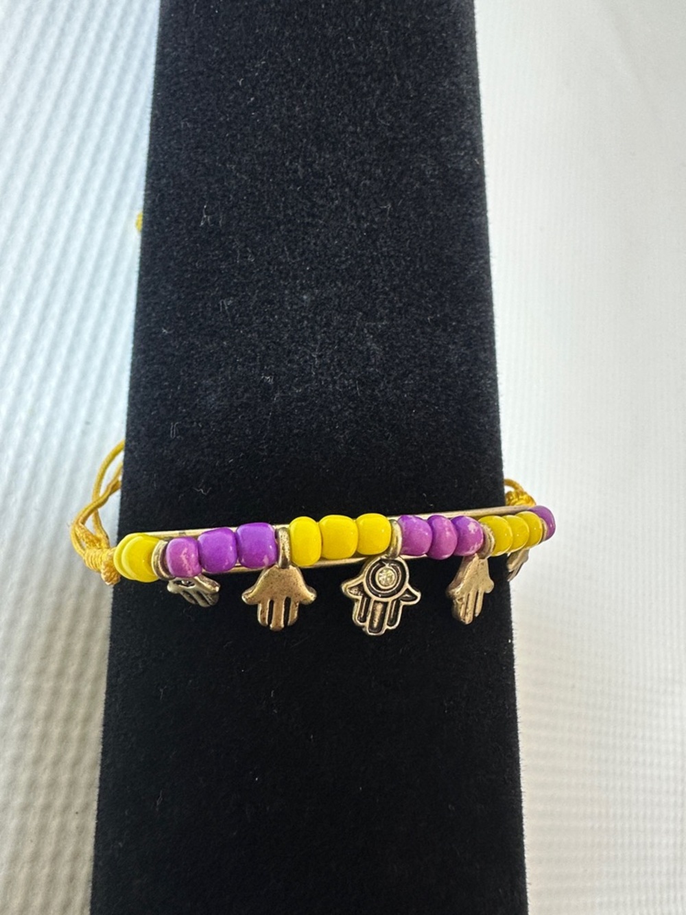 Purple and Yellow Beaded Bracelet with Hamsa Charms